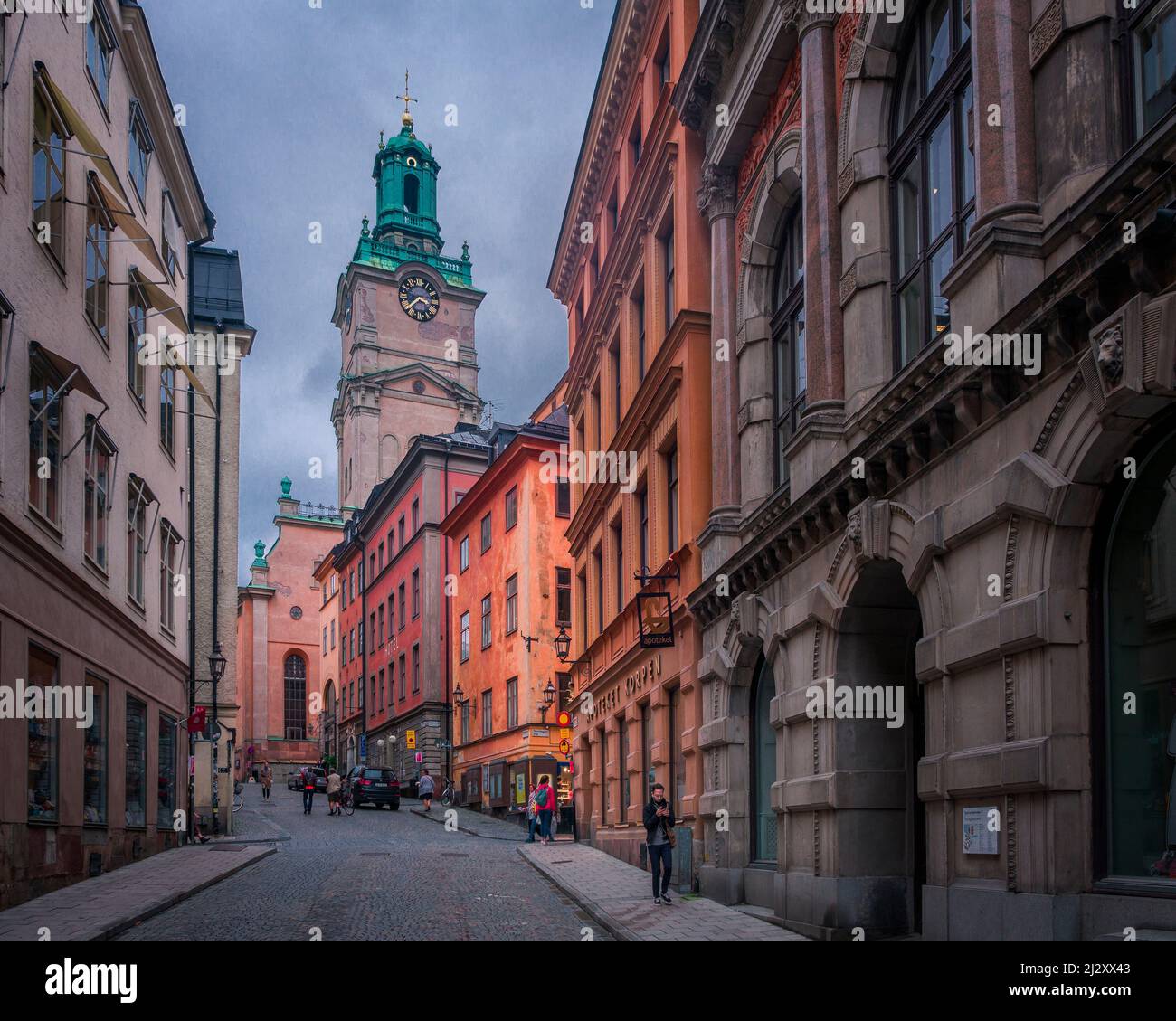 House facades with Tyska Kyrkan church in the old town Gamla Stan in Stockholm in Sweden Stock Photo