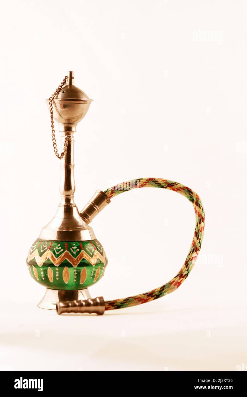 Shisha Pipe. Commonly found in North Africa and the Middle East, the  hookah is water pipe is used to smoke tobacco Stock Photo