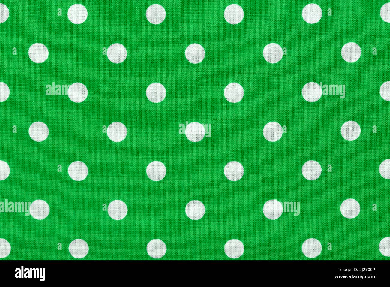 Tile pattern with white polka dots on green background. Stock Photo