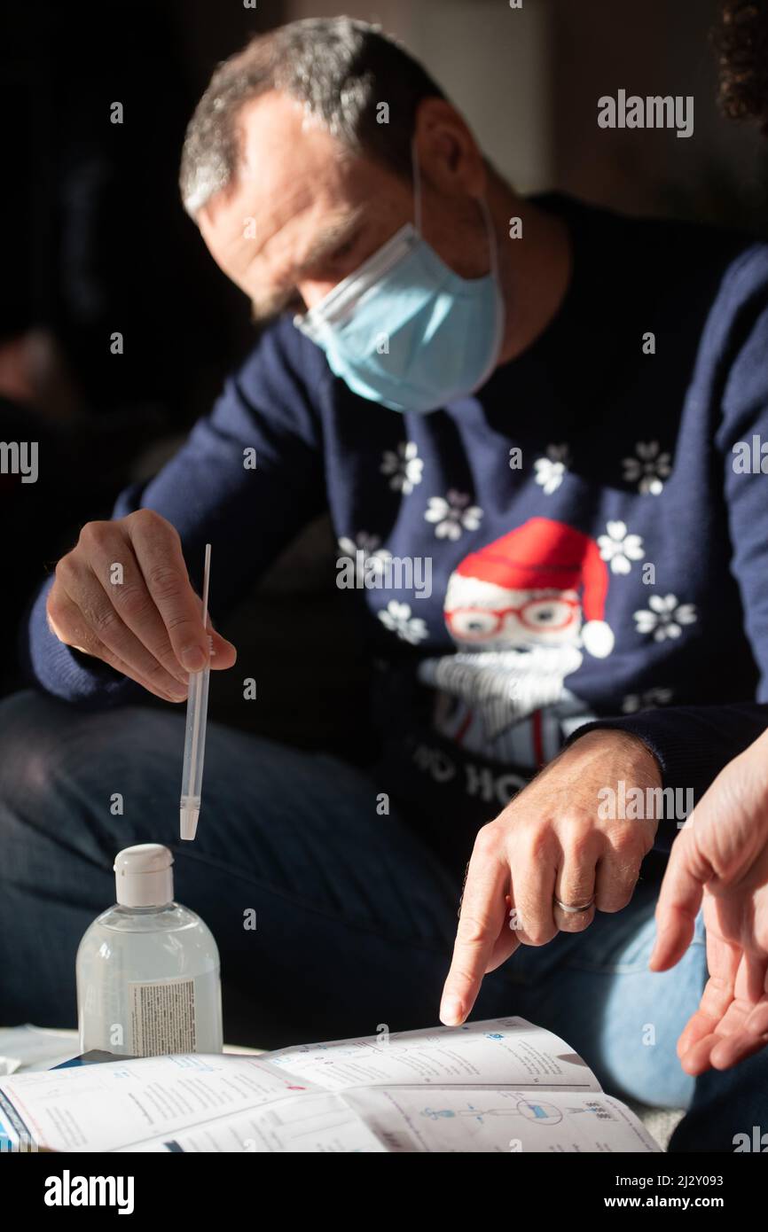 Covid-19, Coronavirus outbreak: man taking a self test before the Christmas and New Year celebrations Stock Photo