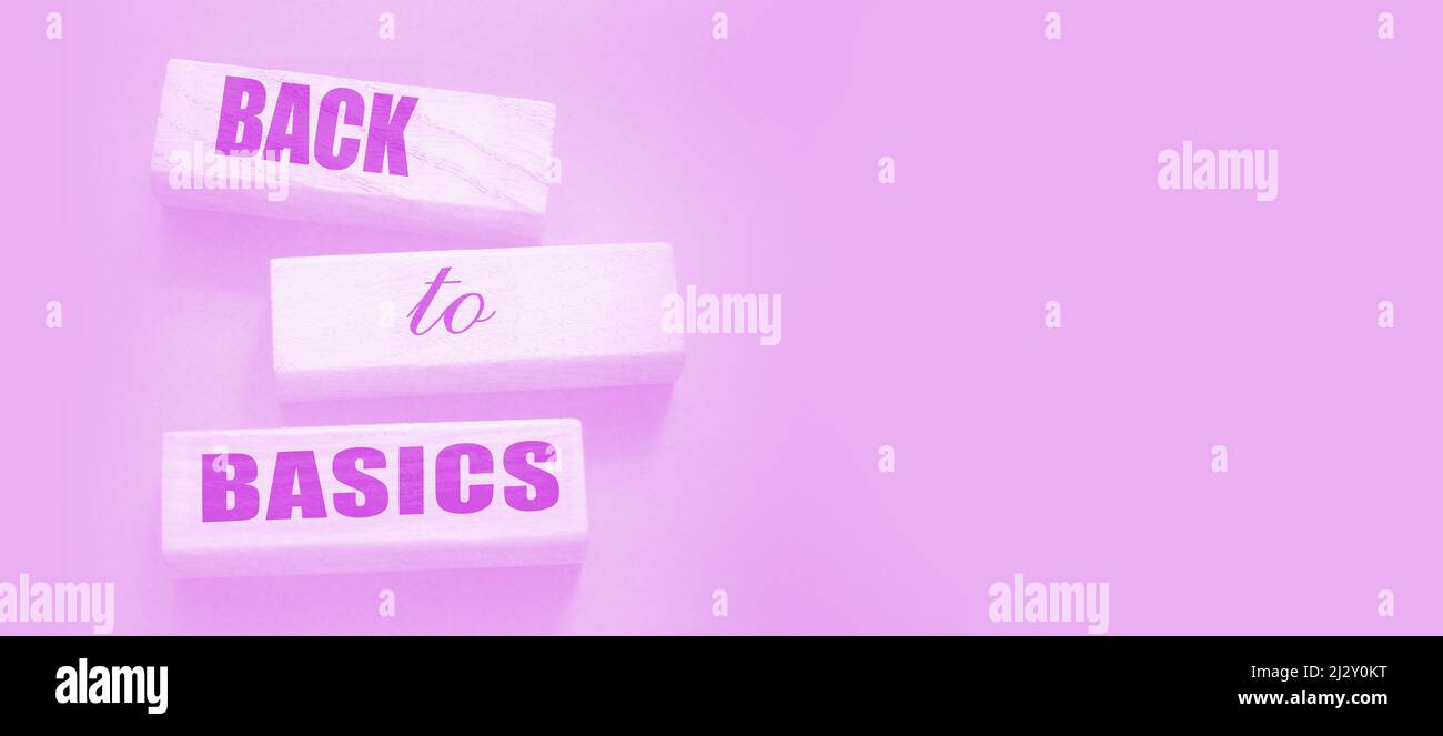 The words back to basics made of letters on wooden blocks. back to basics - fundamental principles concept Stock Photo
