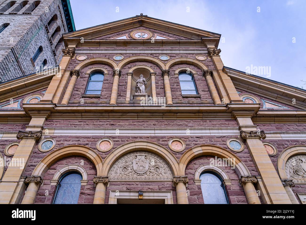 Facade or exterior wall of a Christian religious building. The Saint Paul's Basilica is the oldest Roman Catholic congregation in the city. The church Stock Photo