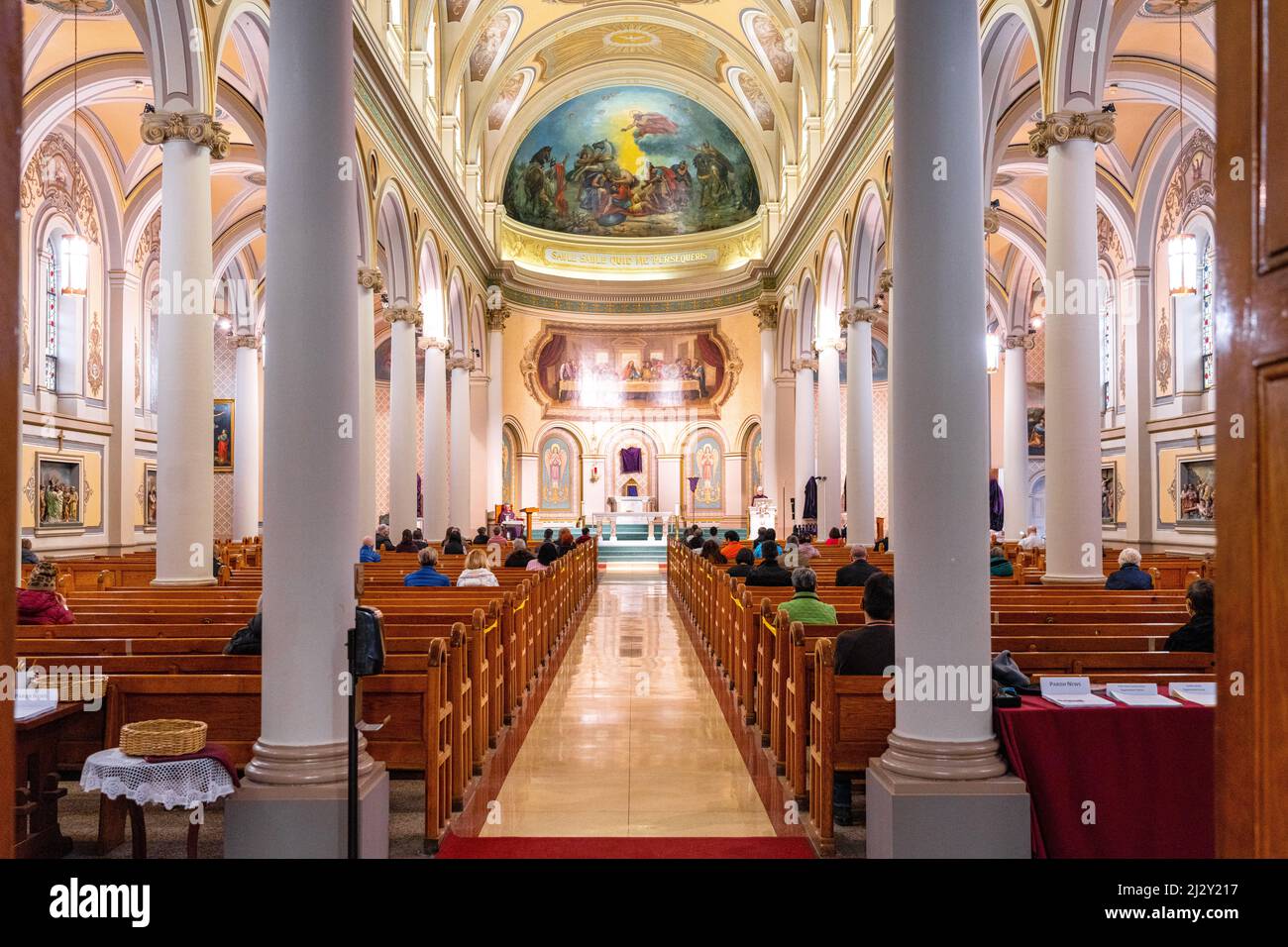 Indoor symmetry of Christian religious building with a fresco painting in the front. Saint Paul's Basilica is the oldest Roman Catholic congregation Stock Photo