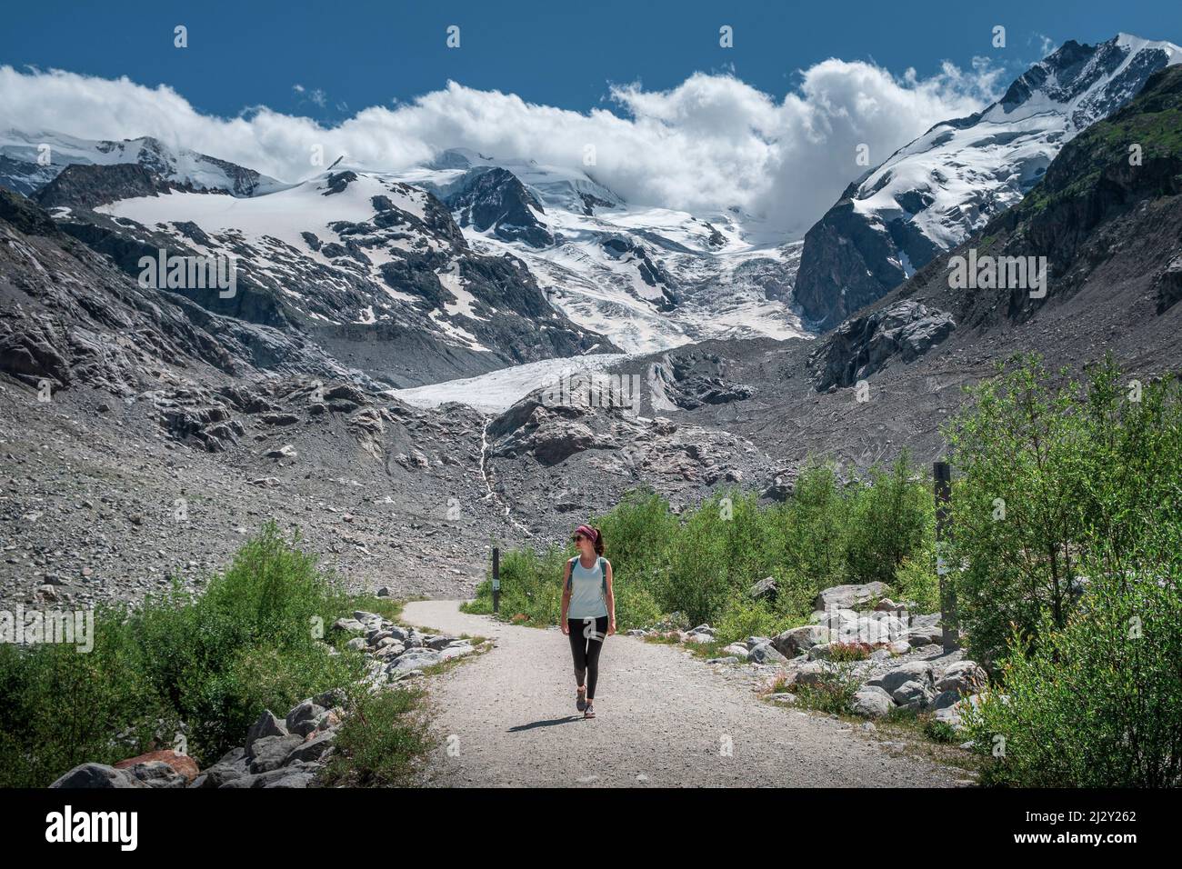 Woman hiking on the Morteratsch Glacier in the Engadin in the Swiss Alps in summer Stock Photo