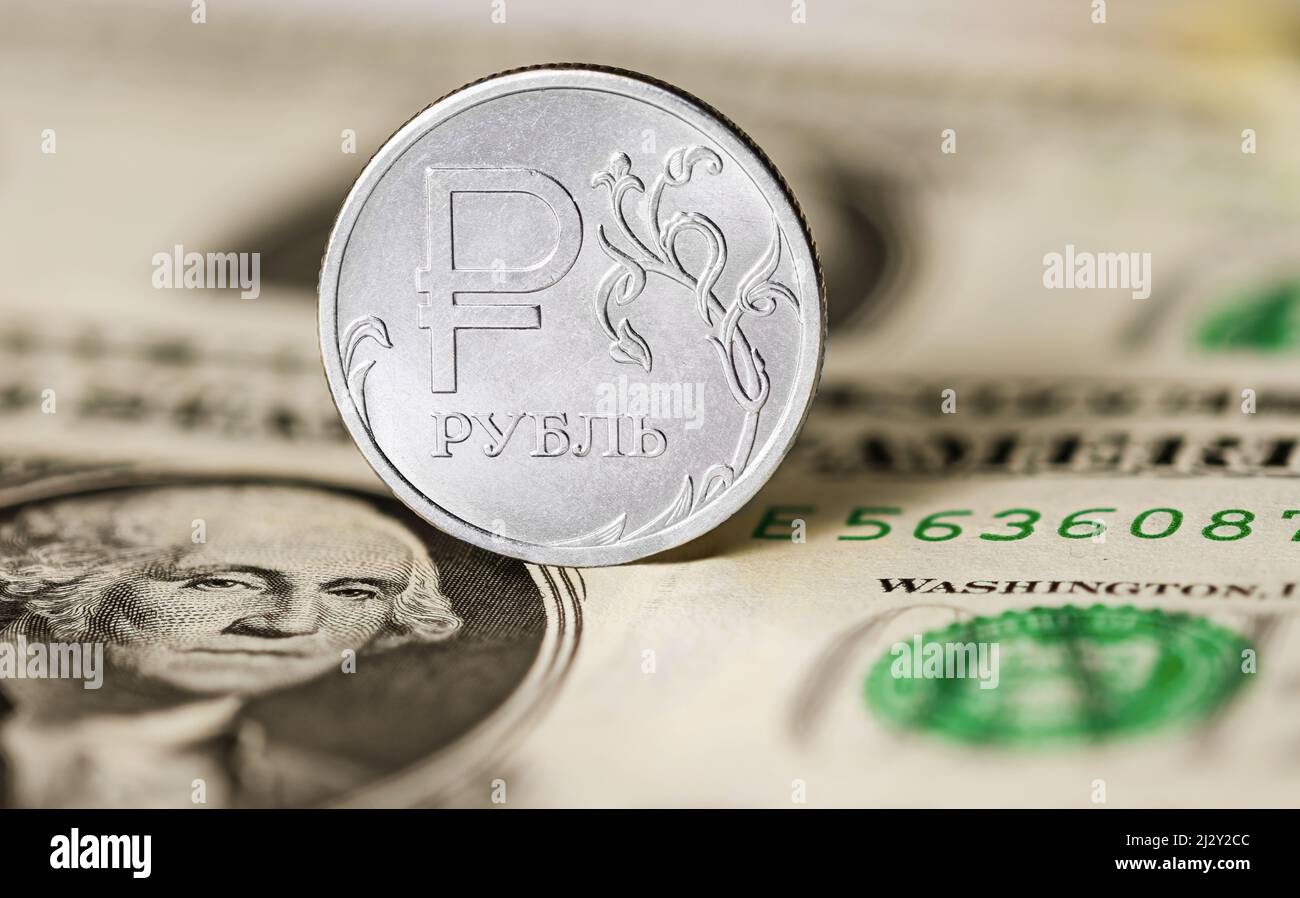 Russian ruble coin against the background of 1 US dollar note Stock Photo