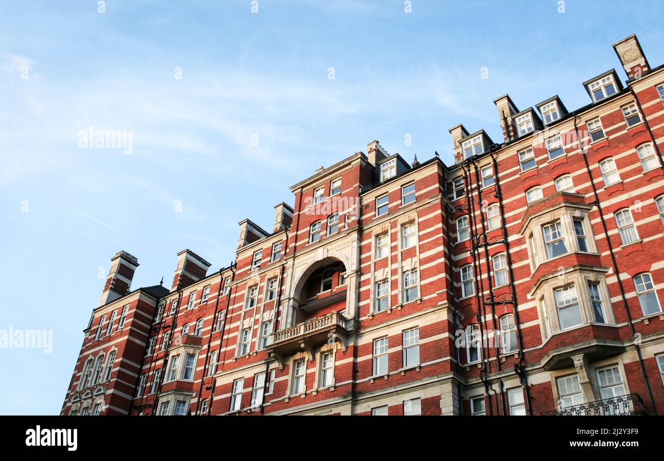 London Apartments, Kensington, London. A low angle view of a block of luxury Edwardian flats in an upmarket district of West London. Stock Photo