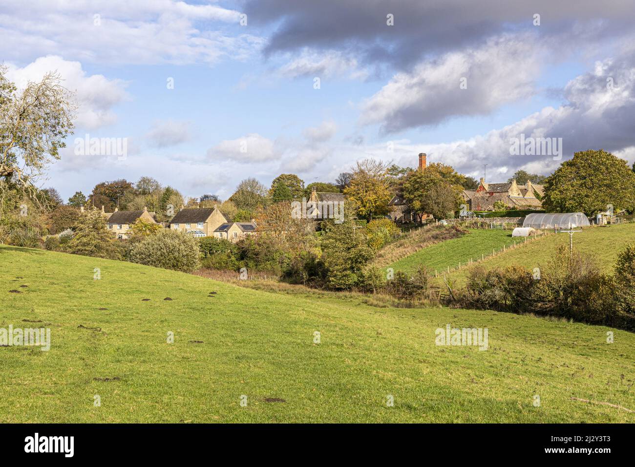 An autumn sky over the Cotswold village of Brockhampton, Gloucestershire, England UK Stock Photo