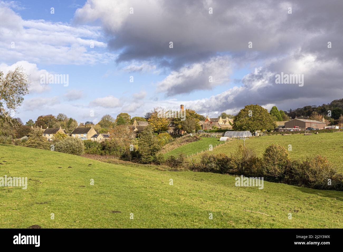 An autumn sky over the Cotswold village of Brockhampton, Gloucestershire, England UK Stock Photo