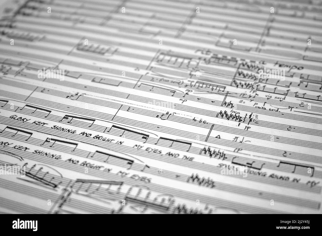 Music Manuscript. Full frame, selective focus on an open orchestral manuscript score. Stock Photo