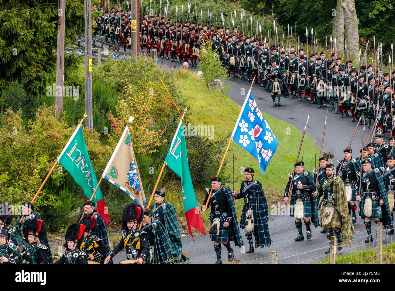Men of Lonach parade, pipe band in highland dress, Strathdon, Aberdeenshire, Scotland UK Stock Photo