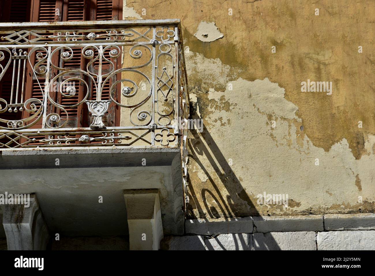 Old Neoclassical house balcony with a handcrafted wrought iron railing ...