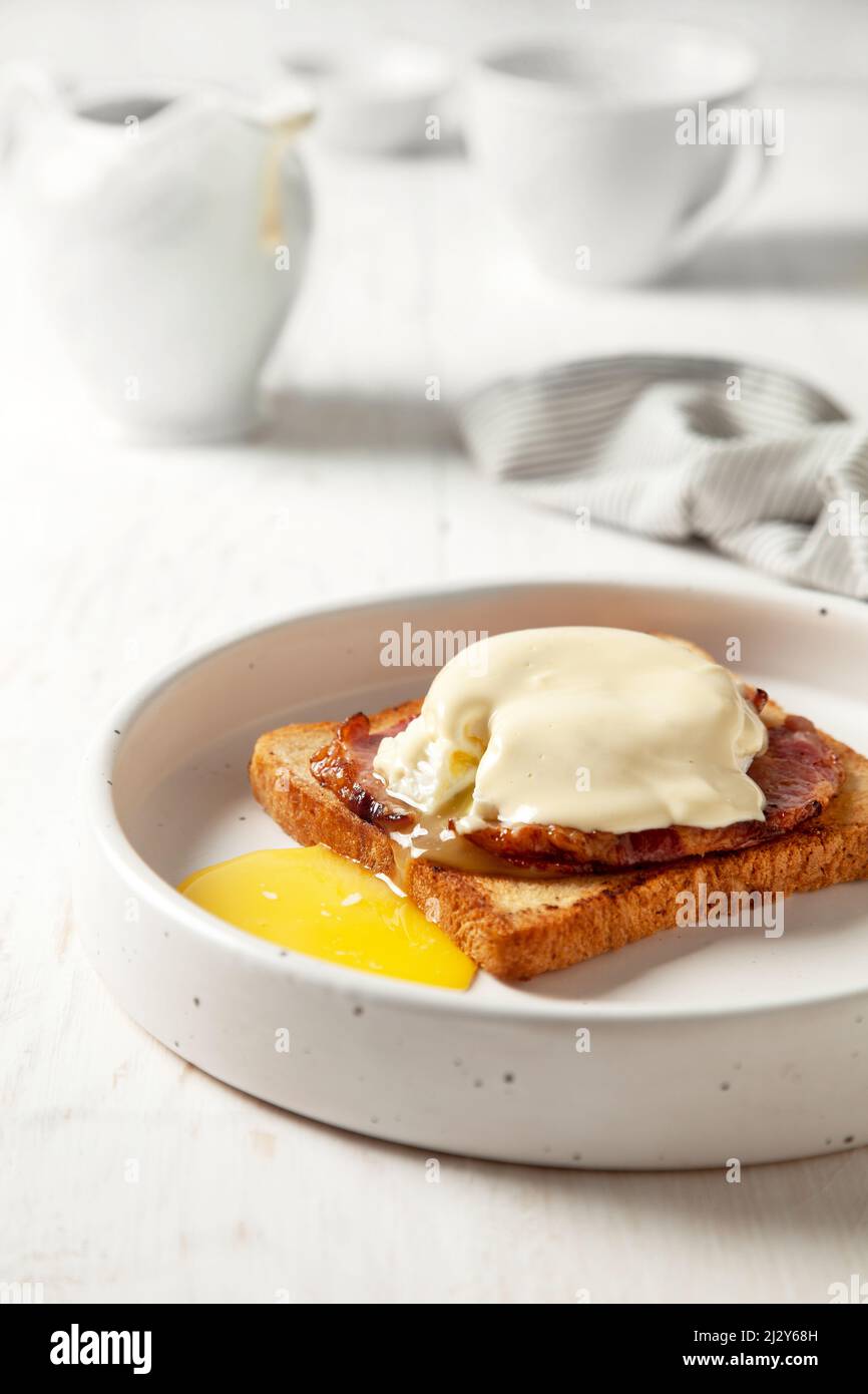 eggs benedict on a white plate Stock Photo