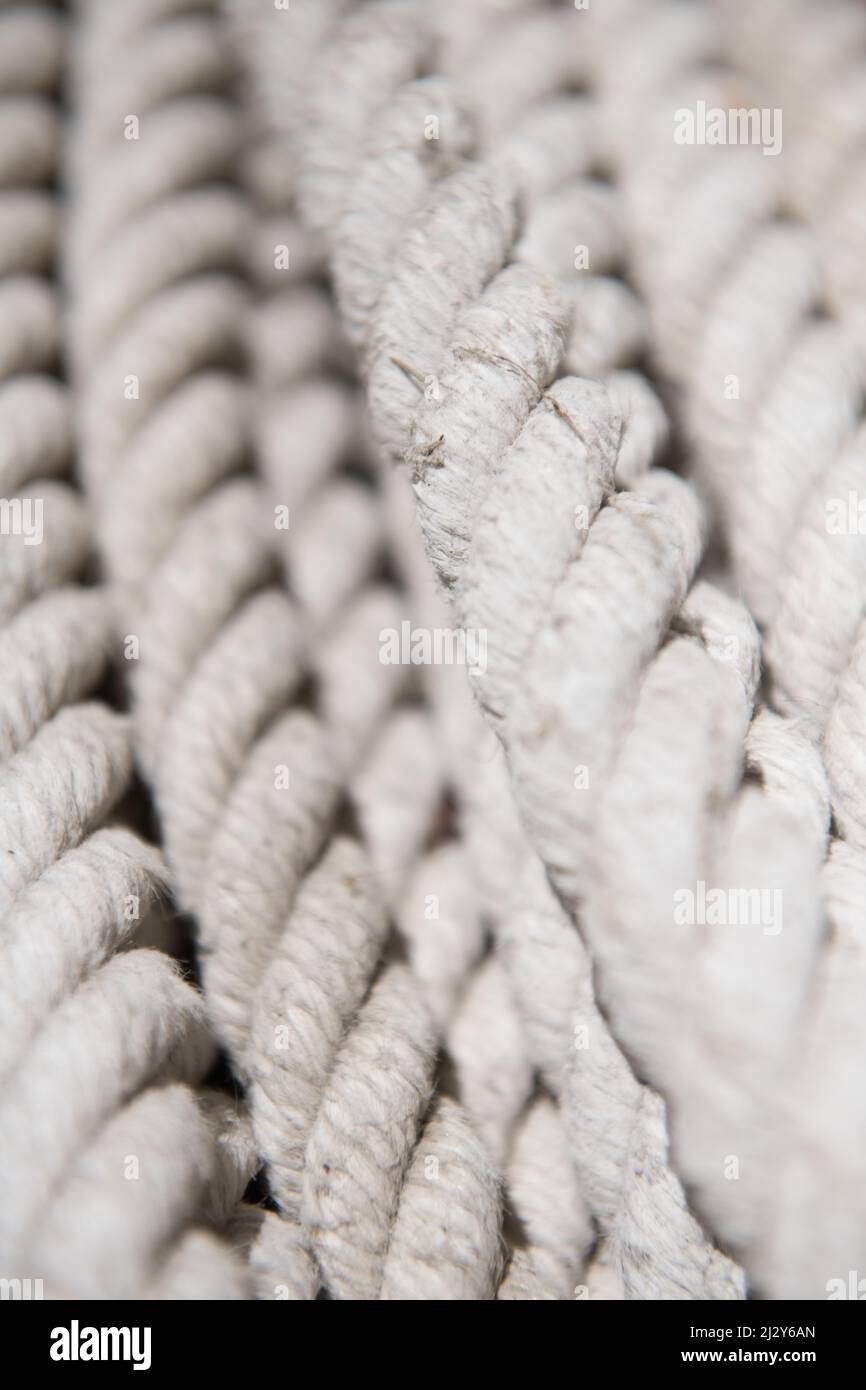 Vertical closeup shot of a white tight rope in Juan Lacaze, Uruguay Stock Photo