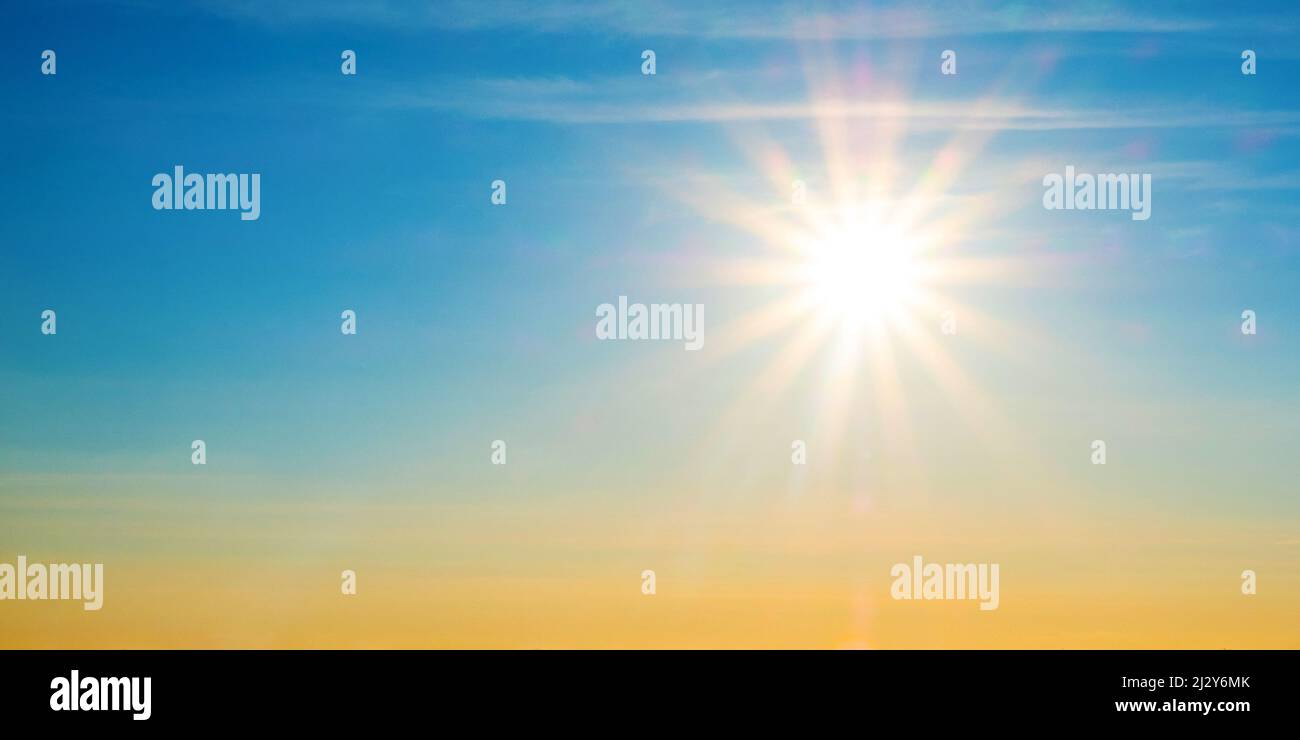 beautiful setting sun and blue sky with copy space. Stock Photo