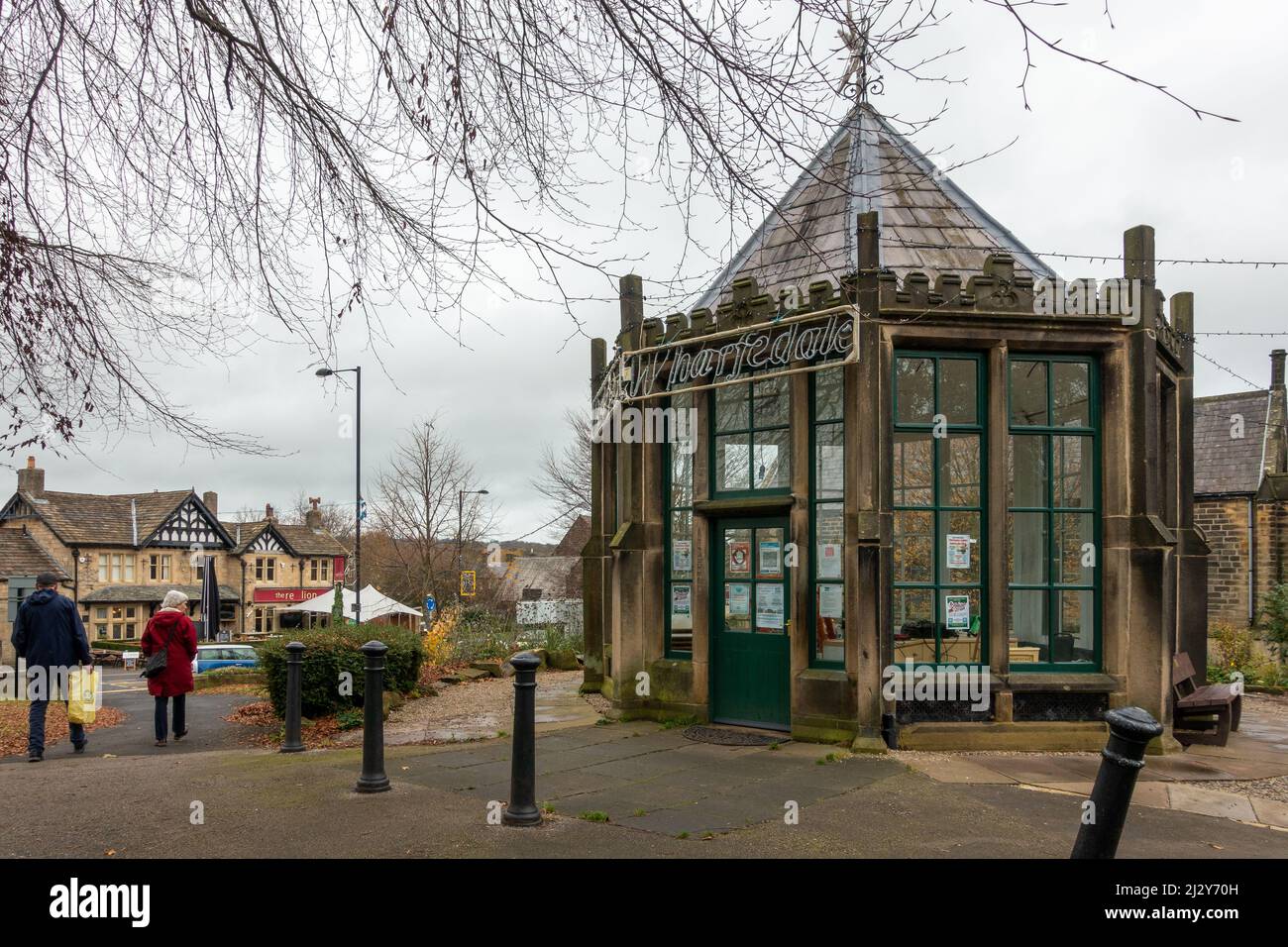 Burley-in-Wharfedale village centre with The Round House in the foreground and The Red Lion pub in the background. West Yorkshire, UK Stock Photo