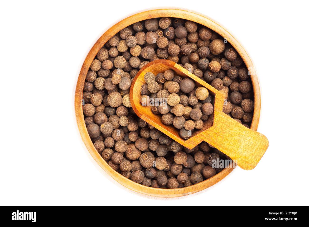 Spice Allspice in wooden scoop and bowl on white background. Flat lay