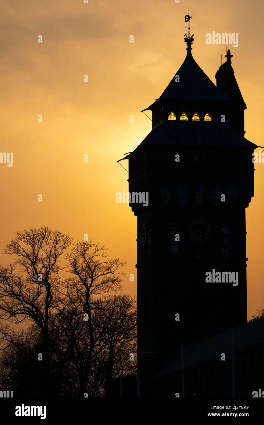 A silhouetted view of Cardiff Castle in Cardiff, Wales, United Kingdom at sunset. Stock Photo