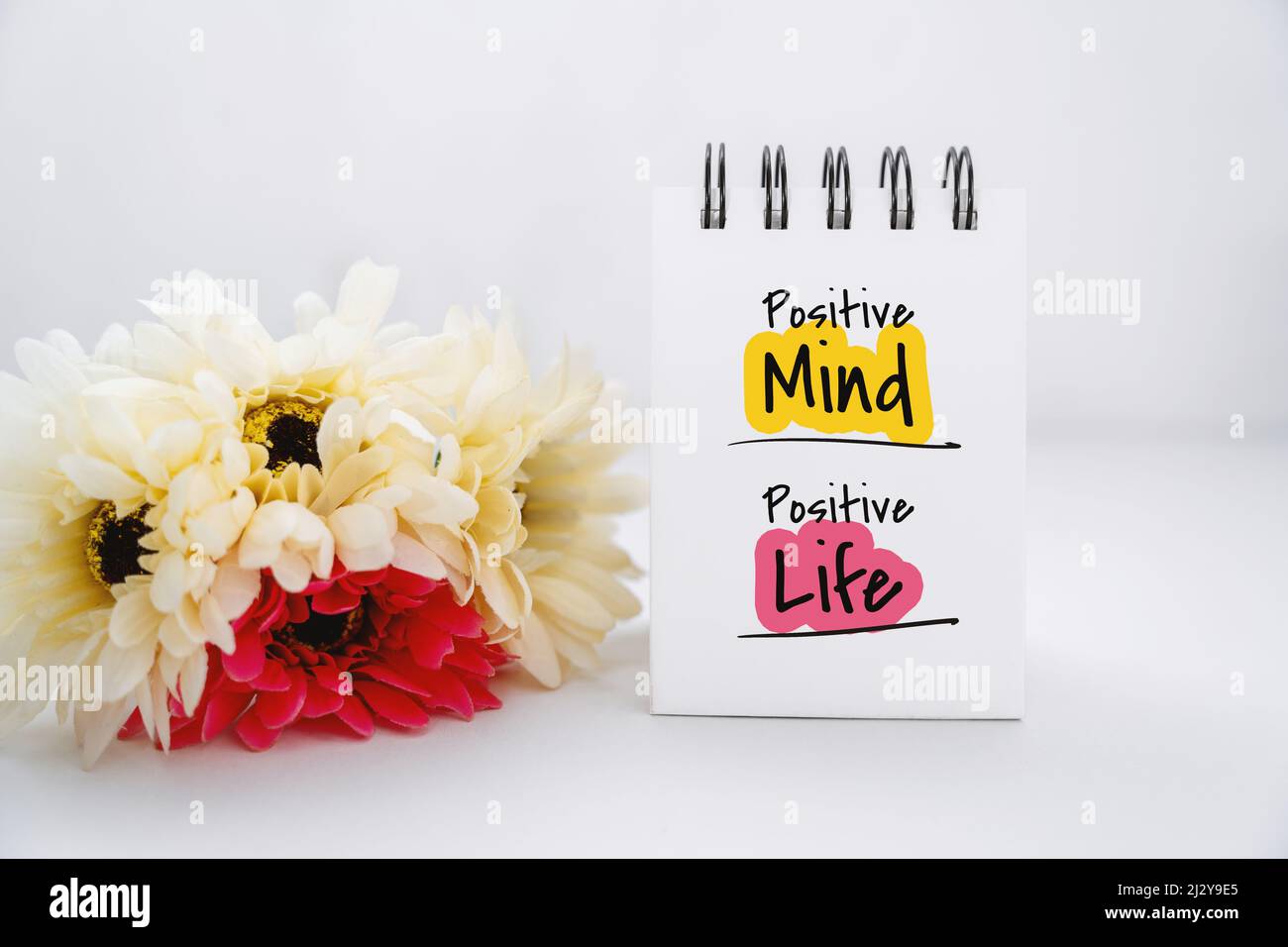 Notebook With Inspirational Quote With Flowers Decoration. Positive Mind Positive Life Stock Photo