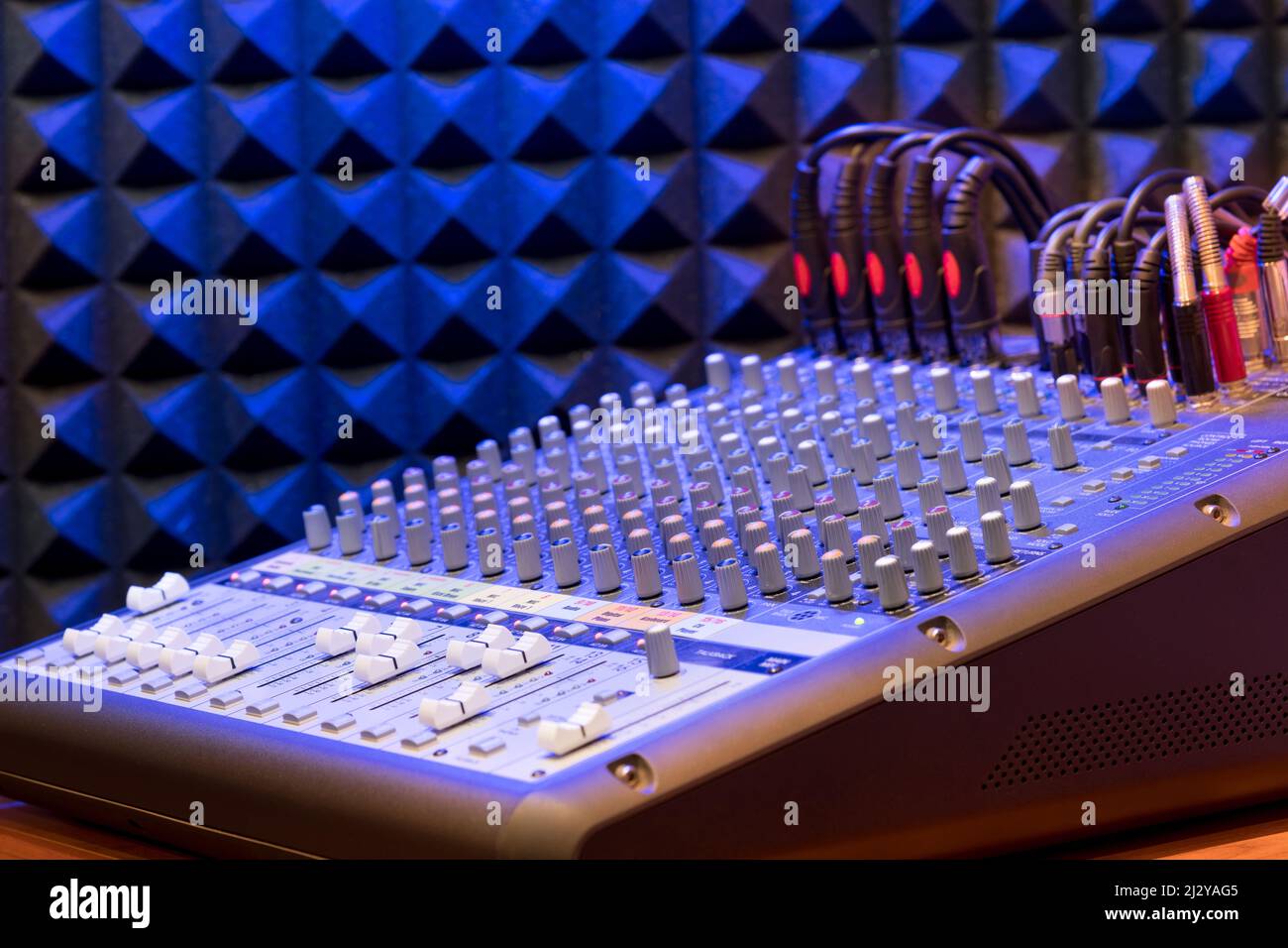 High angle of professional sound mixer control with lot of switches placed in modern recording studio Stock Photo