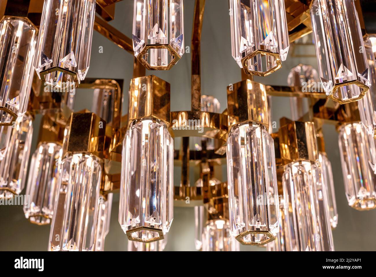 Close up on the stylish faceted glass prisms of a modern chandelier