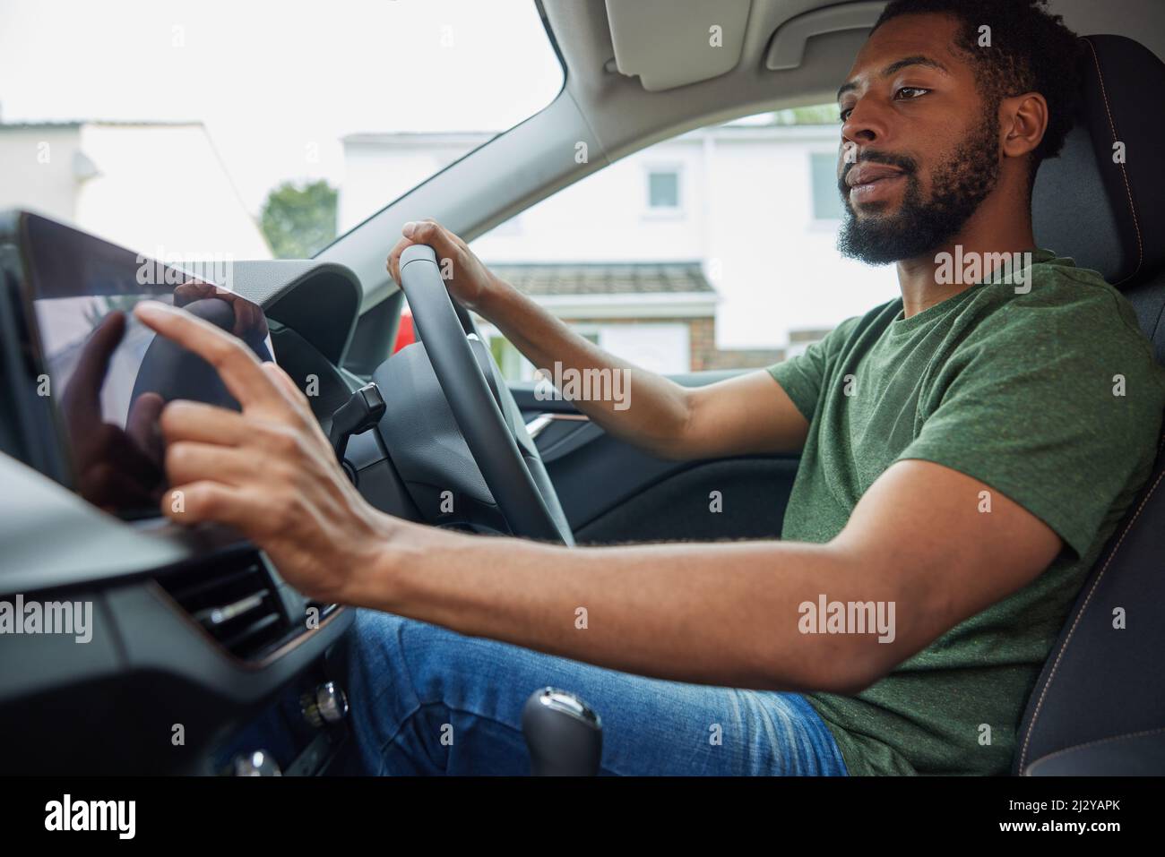 Man Using Touchscreen Whilst Driving Car Stock Photo