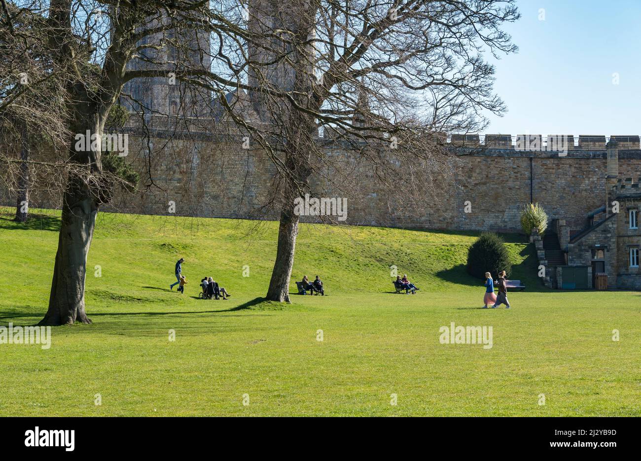 People relaxing in the Castle grounds Lincoln City 2022 Stock Photo