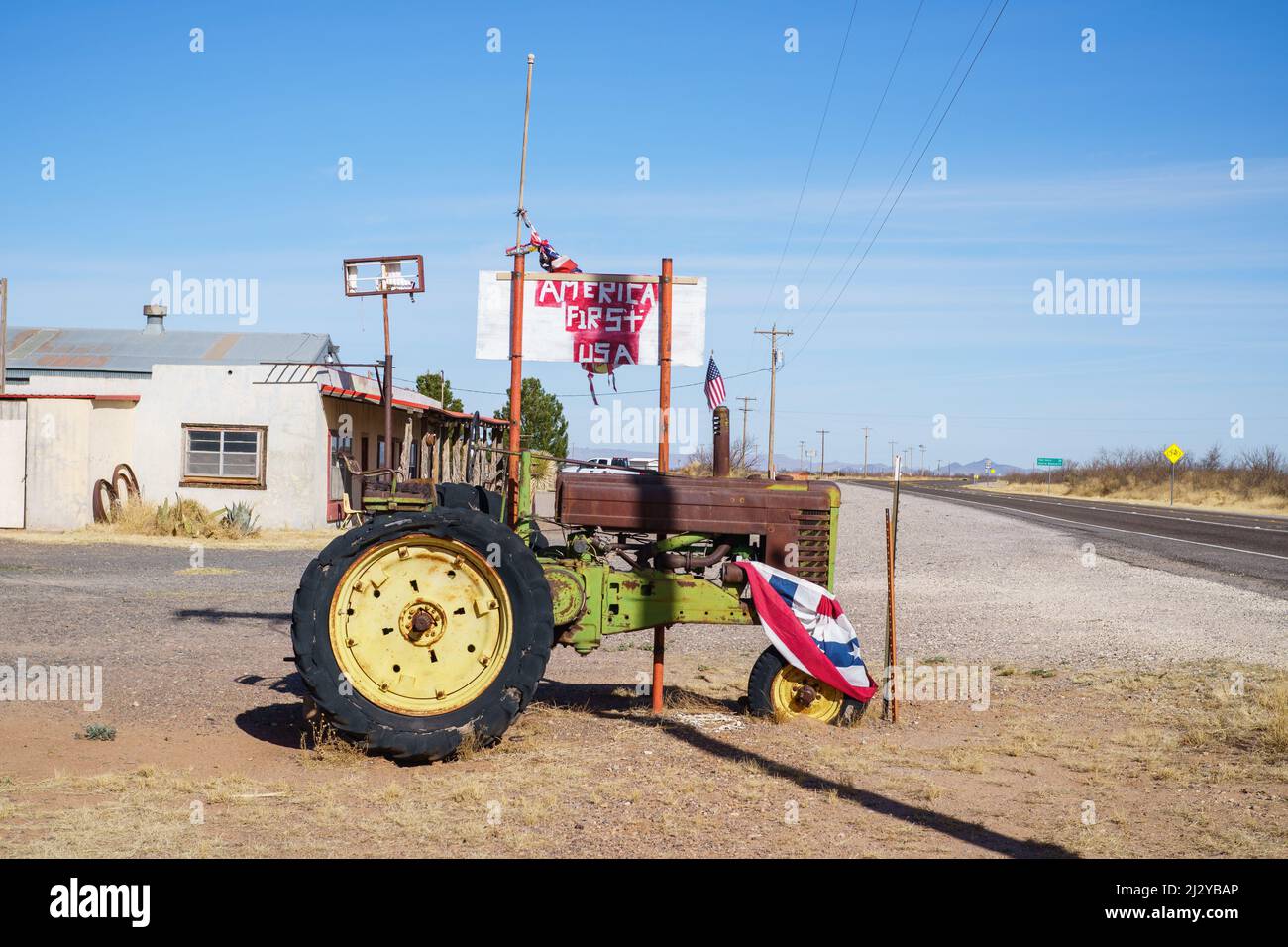 Rural America First Sign with Tractor in Texas Stock Photo