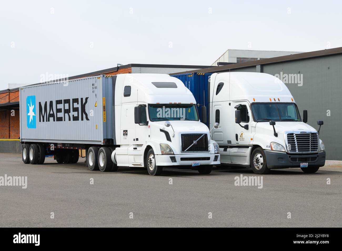 Seattle - April 03,  2022;  Tractor trailor rigs parked in the Industrial District of Seattle including with a Maersk container Stock Photo