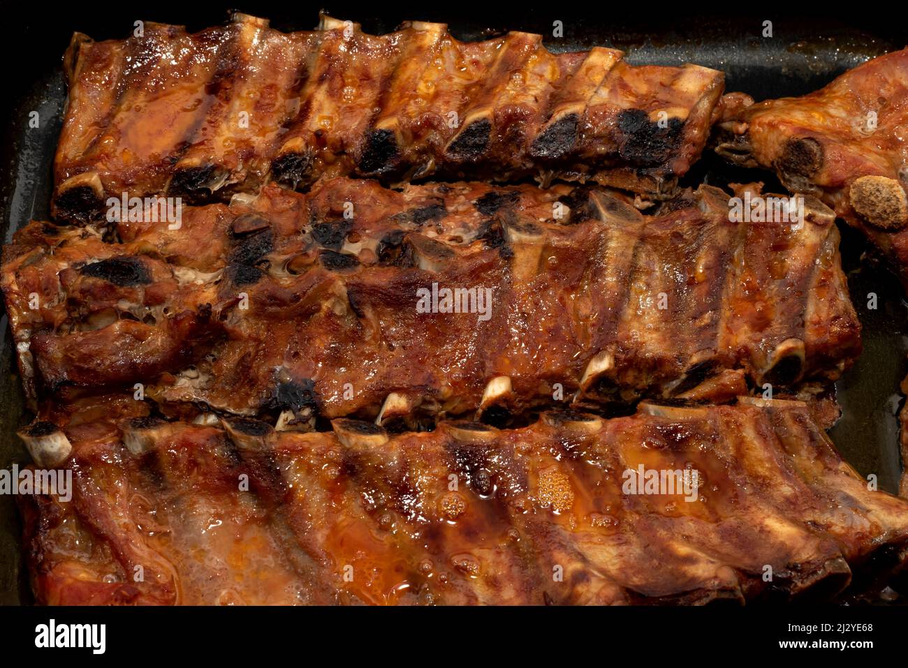 Spare ribs are fried in the pan hi-res stock photography and images - Alamy