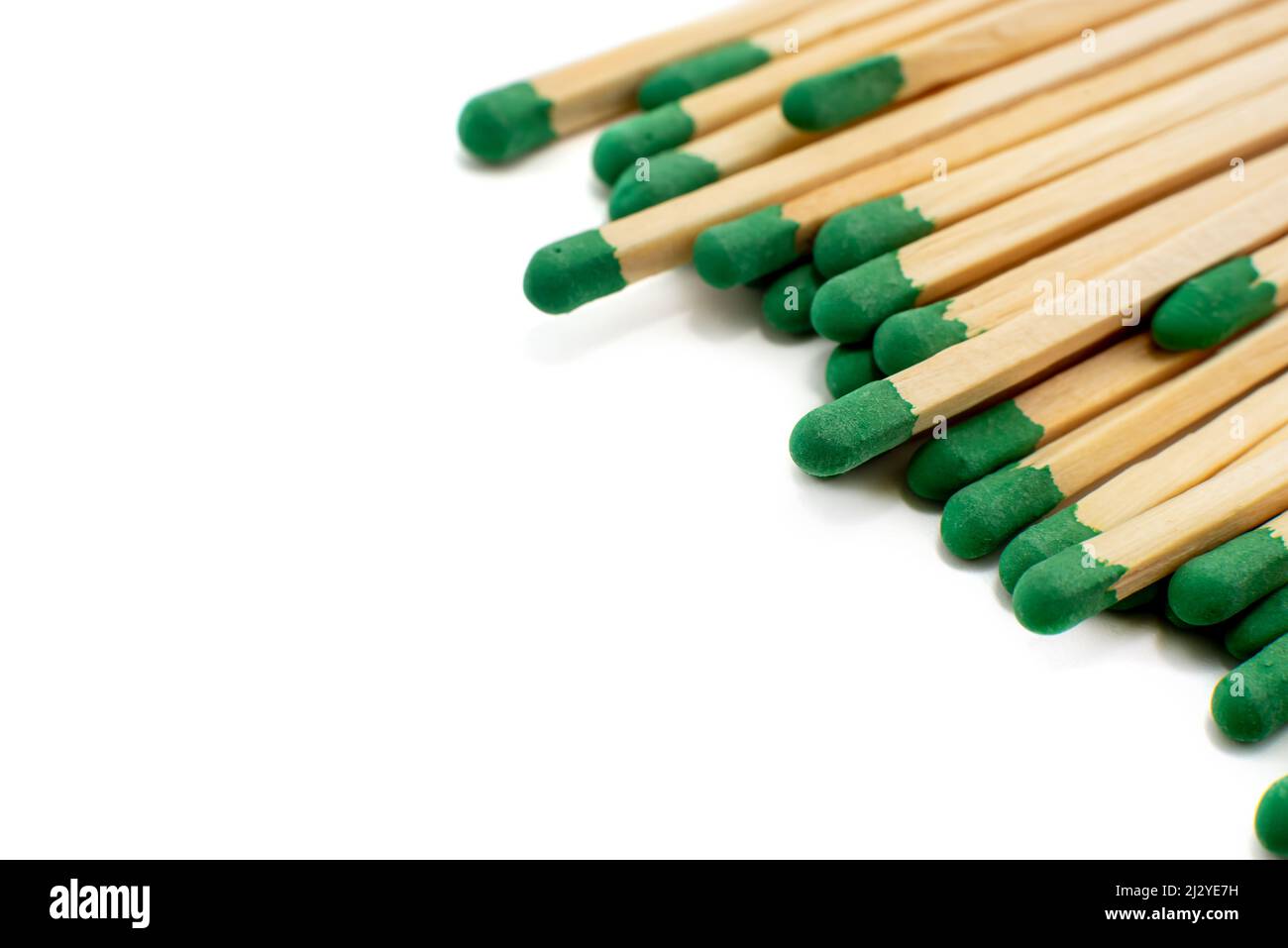 Green matches on a white background. Isolate of matches for kindling a