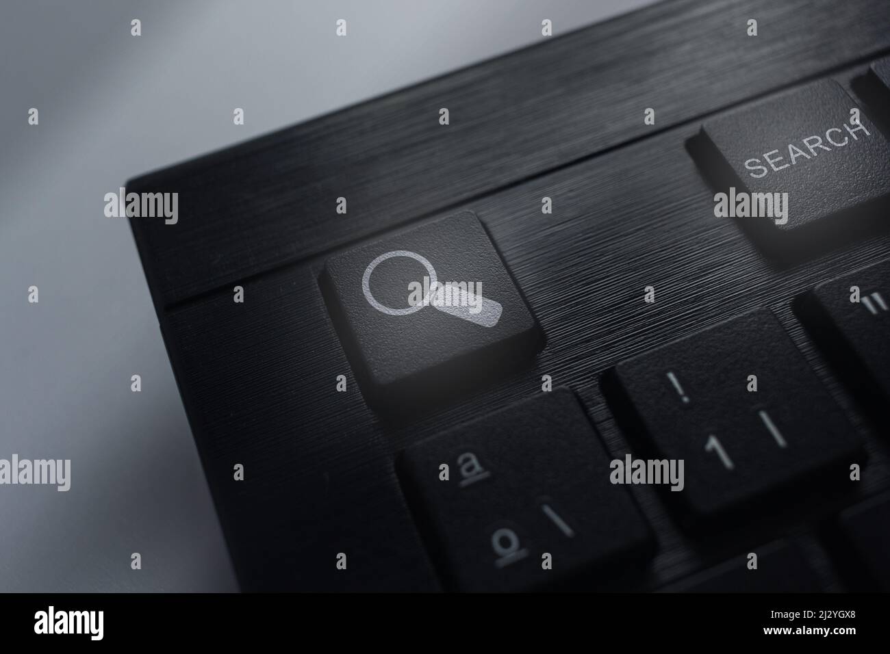 Keyboard with search button. Concept of searching browsing Internet data information. Stock Photo