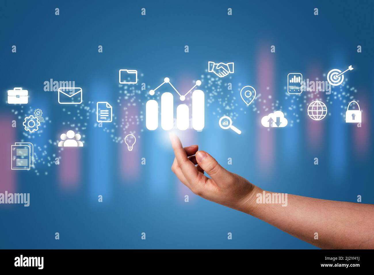 Hand pointing a growing virtual hologram stock with business icons. Stock market. Growth, progress, success, cloud, mail, contacts, global security. I Stock Photo