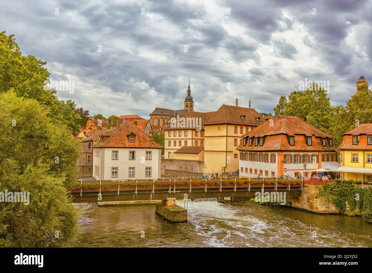 Half-timbered houses and pedestrian bridge over the Regnitz River in