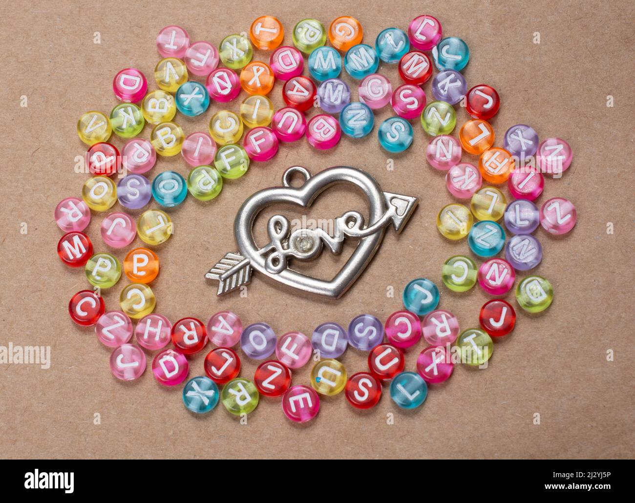 Heart shape and love wording amid colorful alphabet letters Stock Photo ...