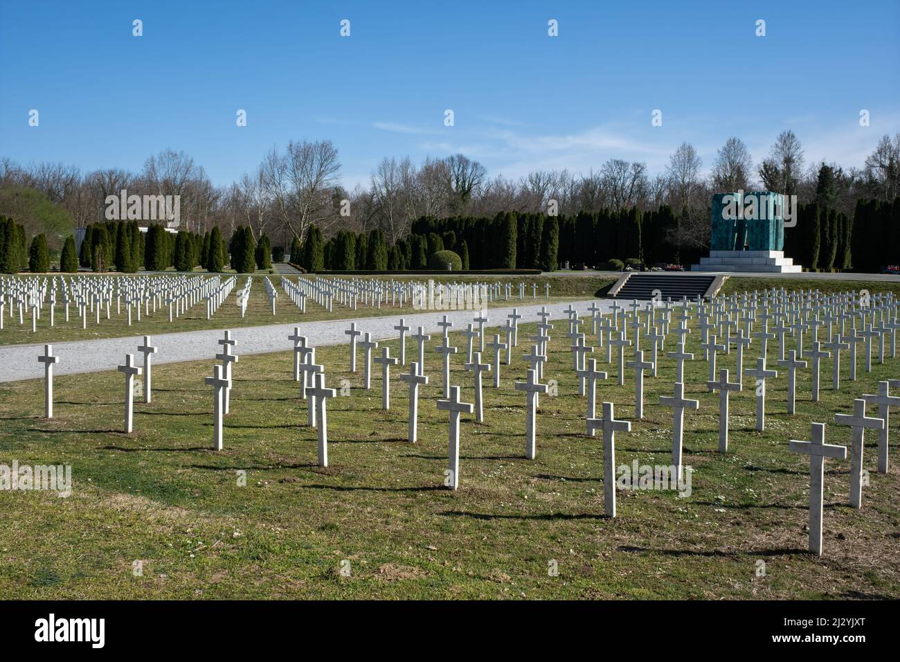 Vukovar, Croatia - March 28, 2022: Vukovar Memorial Cemetery. 938 white marble crosses, one in memory of each victim. The monument is made of patinate Stock Photo