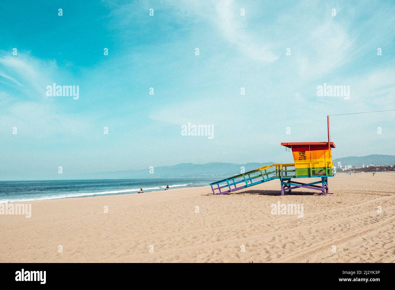 A colorful rescue tower on a beach under the blue sky Stock Photo - Alamy
