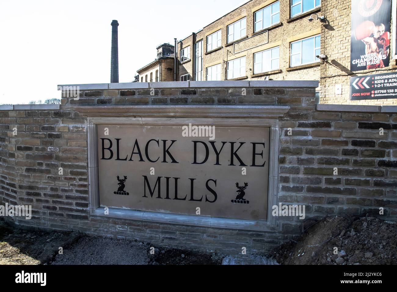 Black Dyke Mills stone engraving at the forefront of the famous fine fabric mills in Bradford England and home of the world famous brass band Stock Photo