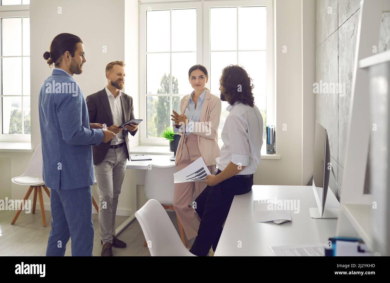 Business partners in office discuss and analyze business plan of new