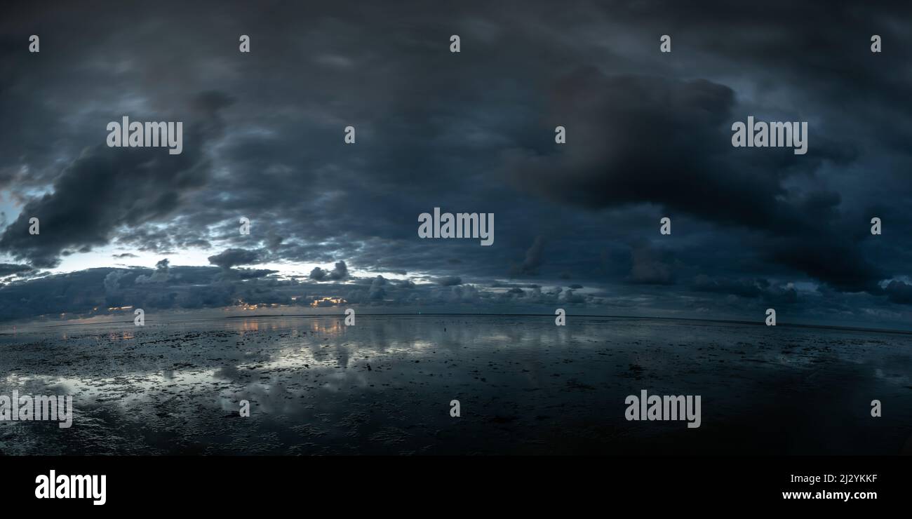 Dusk at the Wadden Sea under rain clouds at the North Sea, Schillig, Wangerland, Friesland, Lower Saxony, Germany, Europe Stock Photo