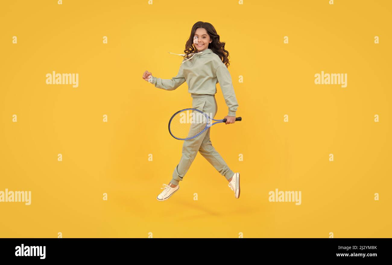 healthy and active lifestyle. sport success. happy childhood. kid jump with racket. Stock Photo