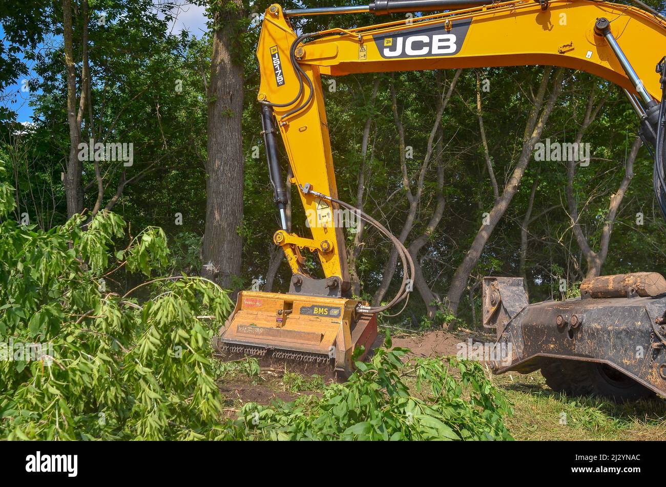 Roadside cleaning device. Mulcher. Processing of branches and vegetation Stock Photo
