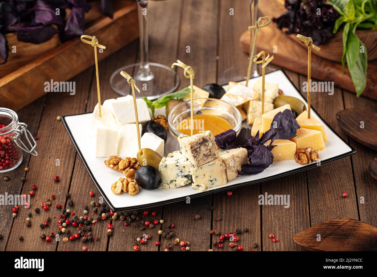 Assorted cheese appetizer platter with honey Stock Photo Alamy