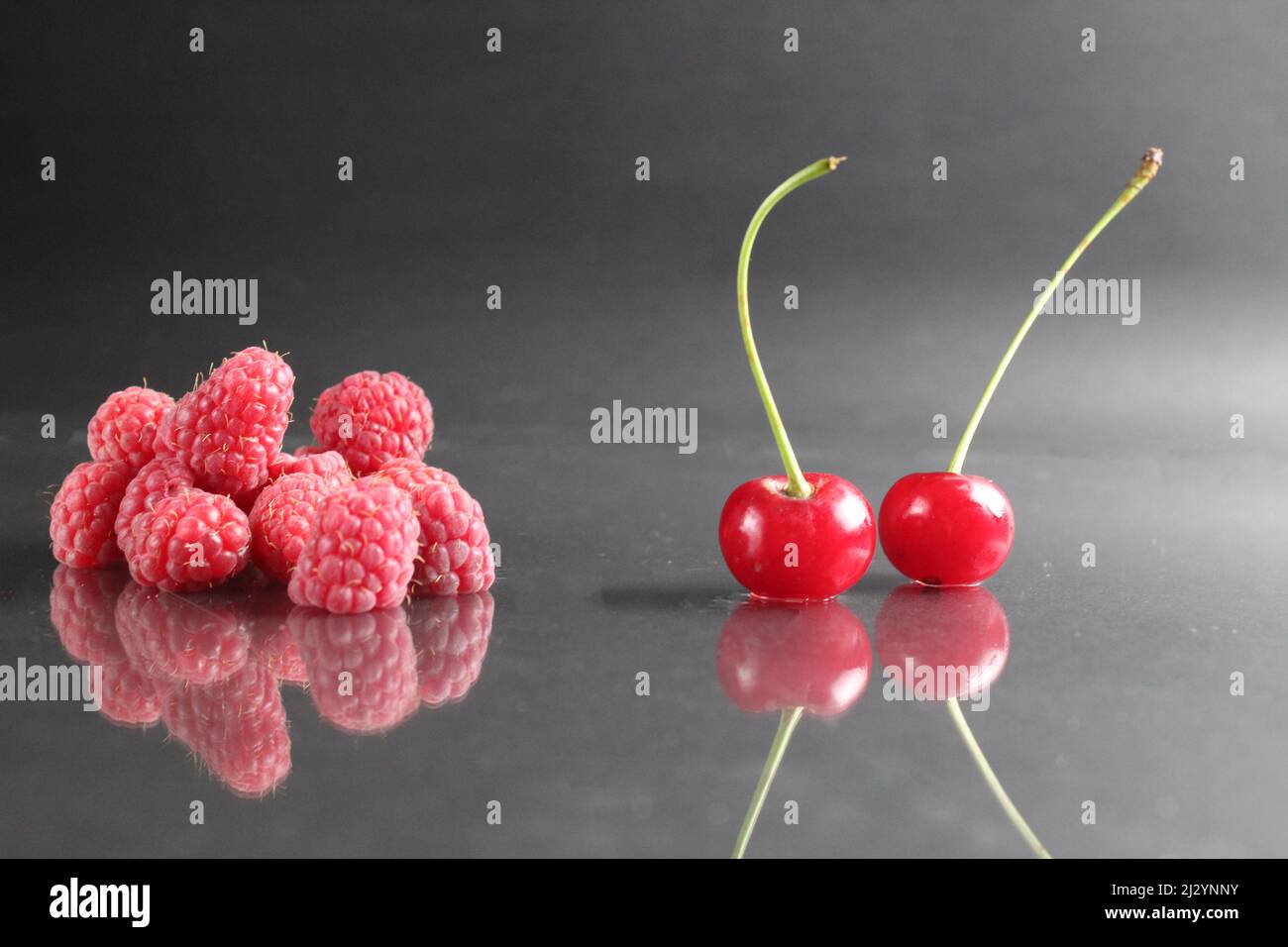 Cherry Vs Raspberry Size cherry berries and raspberries against each other condemnation of ...