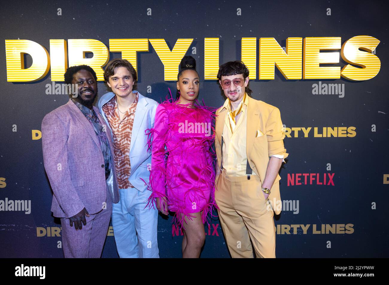 2022-04-04 18:15:00 AMSTERDAM - Joy Delima, Minne Koole, Chris Peters and Andre Dongelmans on the red carpet for the premiere of the Netflix series Dirty Lines. The Dutch series is about life in Amsterdam in the 1980s. ANP KIPPA EVERT ELZINGA netherlands out - belgium out Stock Photo