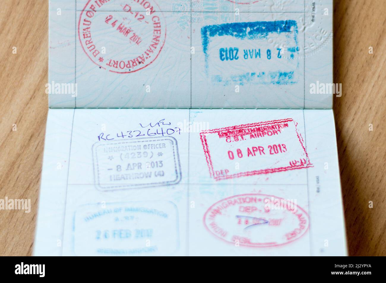 Travel stamps on Passport page Stock Photo Alamy