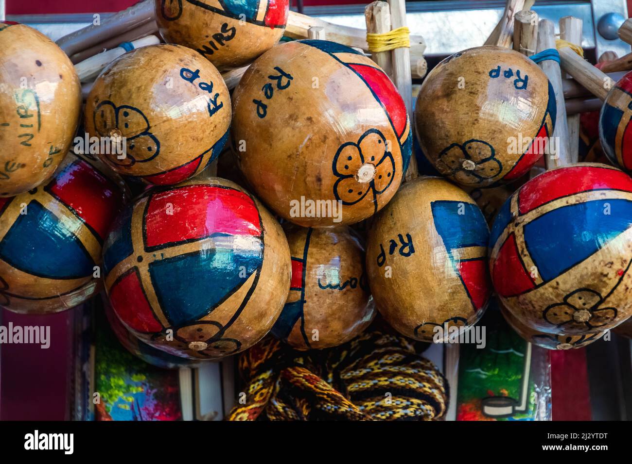 A closeup of wooden maracas at the street market of Santiago de los