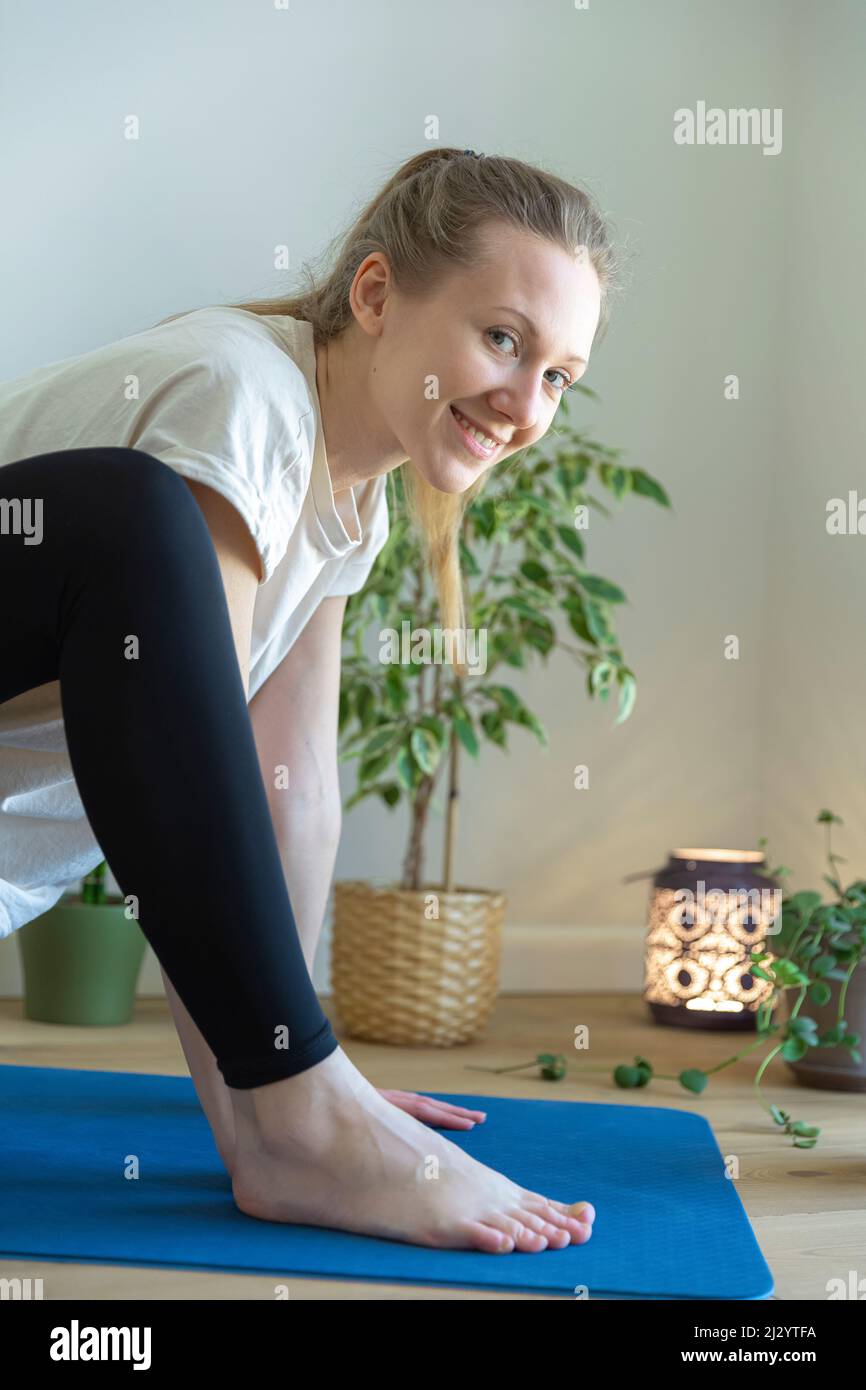 Woman doing stretching exercise hi-res stock photography and images - Alamy