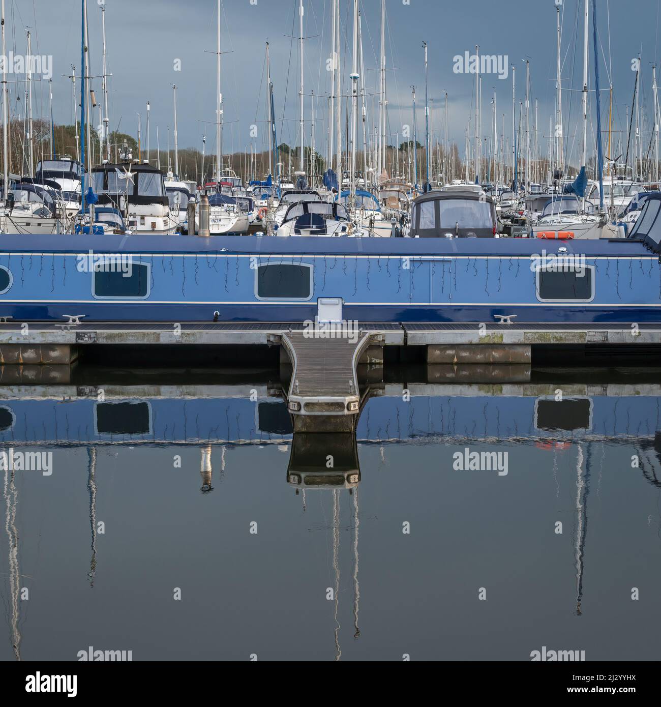 Pleasure craft moored in Chichester Marina, Sussex, England, UK, on a bright sunny winters day Stock Photo