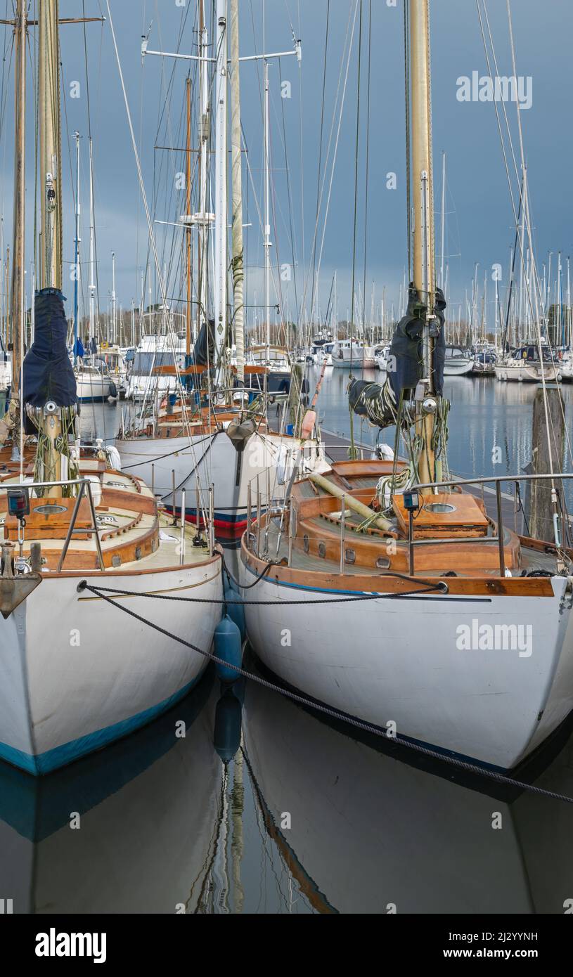 Pleasure craft moored in Chichester Marina, Sussex, England, UK, on a bright sunny winters day Stock Photo