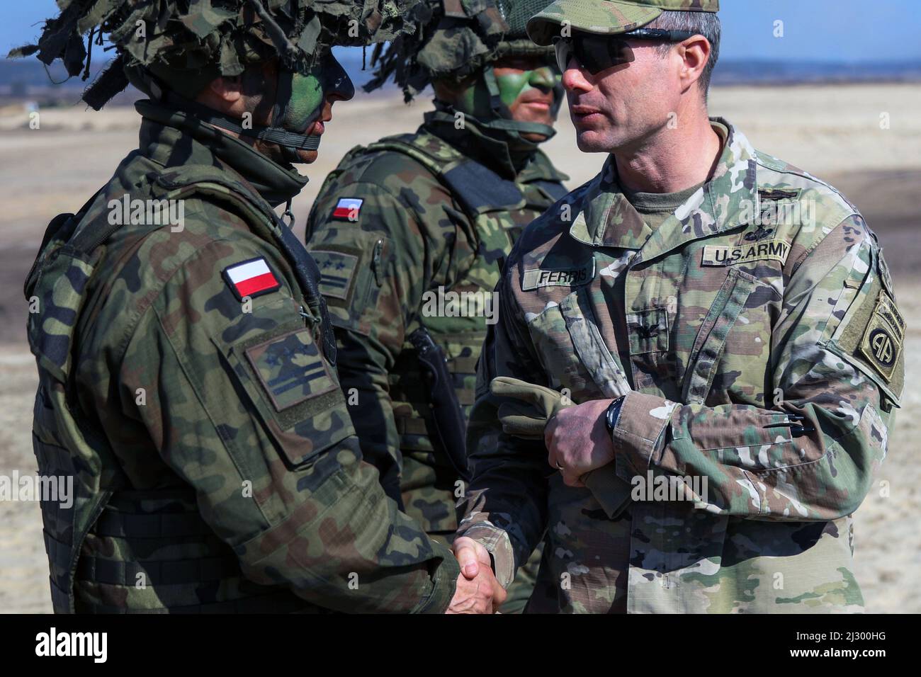 Poland. 17th Mar, 2022. U.S. Army Col. Eugene Buddy Ferris shakes hands with a Polish officer from the 19th Mechanized Brigade after the conclusion of a combined arms live fire exercise between 1st Battalion, 505th Parachute Infantry Regiment, 3rd Brigade Combat Team, 82nd Airborne Division and the Polish's 19th Mechanized Brigade. The 3rd Brigade Combat Team, 82nd Airborne Division is deployed to southeastern Poland to assure our Allies in support of the NATO Alliance. Credit: U.S. Army/ZUMA Press Wire Service/ZUMAPRESS.com/Alamy Live News Stock Photo
